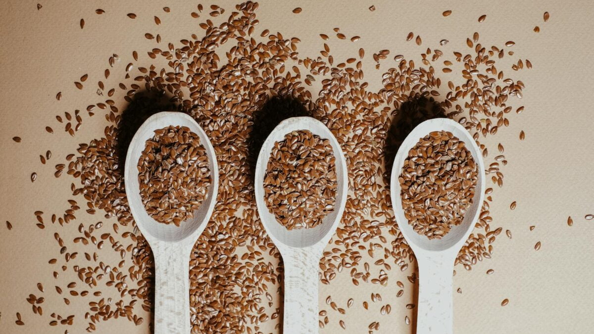 three wooden spoons with flax seeds